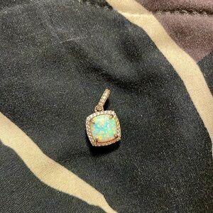 Beautiful opal pendant with cubic zirconia.